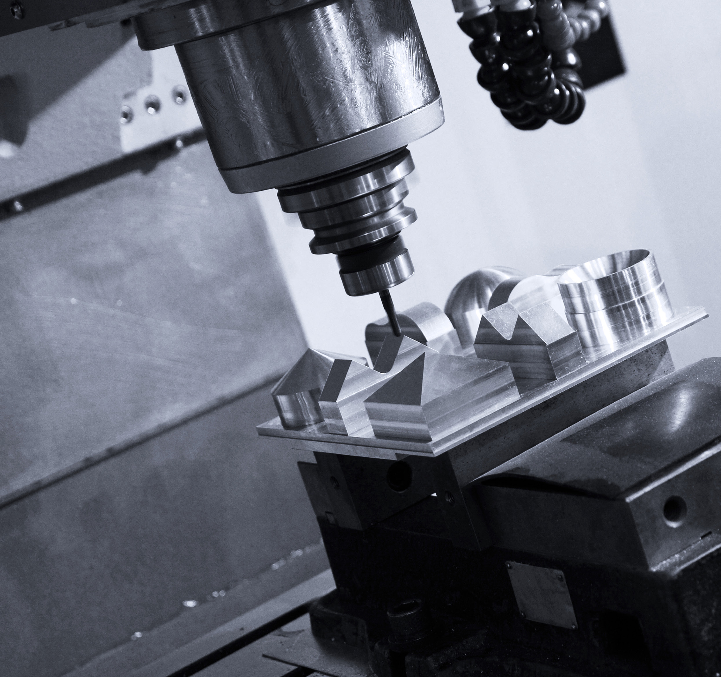 Machine tool spindle cutting a metal part
